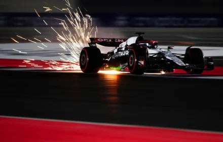 Sparks fly behind Liam Lawson driving the Scuderia AlphaTauri AT04